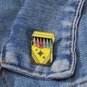 Polychrome Crayon Pack Enamel Pin - Yellow Case with Rainbow Crayons